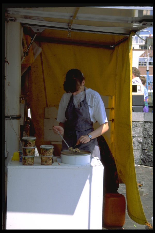 369095 Girl Preparing Cooked Shellfish, Oostende, Belgium A4 Photo Print