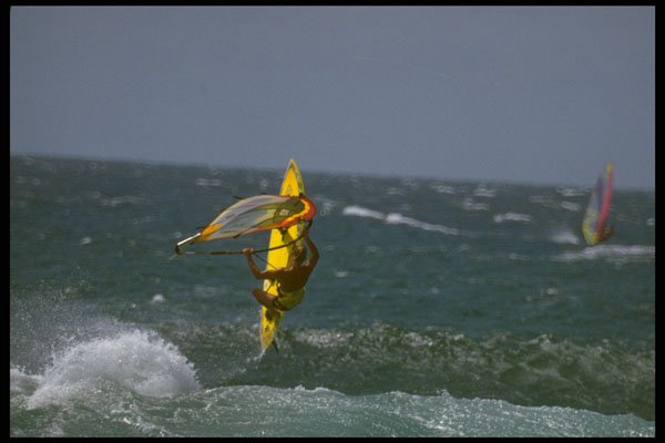 370004 Windsurfer About To Land From Wave Jump A4 Photo Print