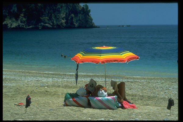 384079 Couple Reading Under Parasol On Beach, Parga, Greece A4 Photo Print