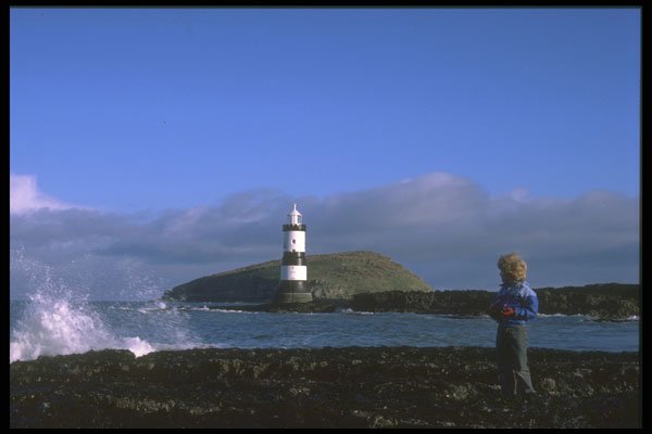 387005 Boy Looking Out Towards Penmon Lighthouse, Anglesey, Wales A4 Photo Print