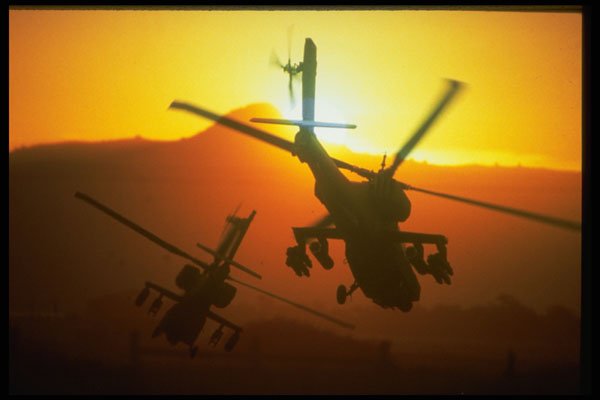 414064 AH 64 Apache, Two Helicopters Maneuver Toward Rising Sun A4 Photo Print