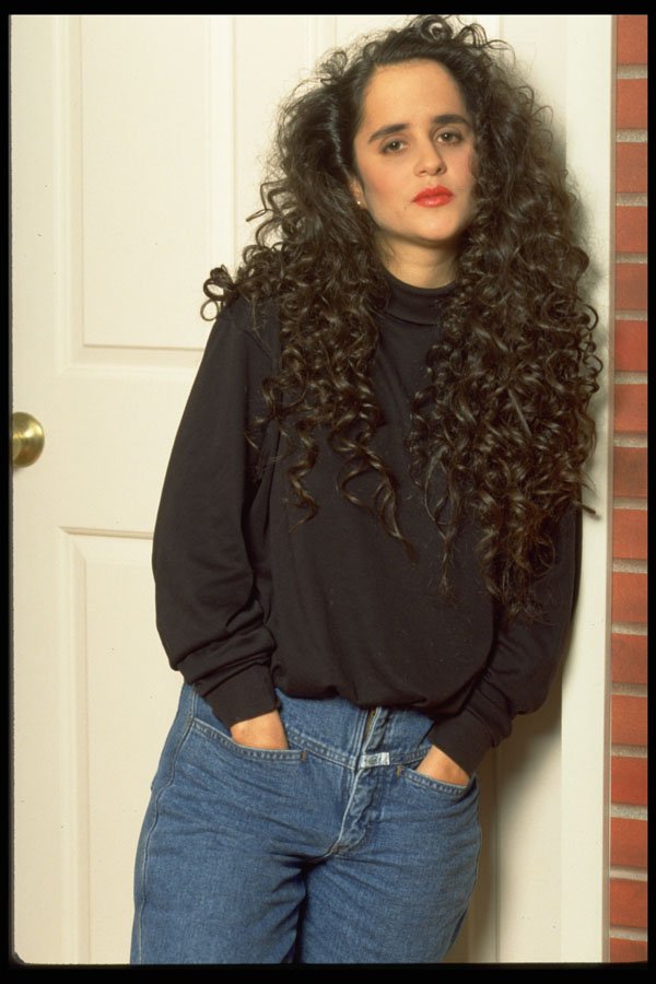 420096 Brunette Leaning Against Doorway A4 Photo Print