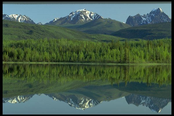 423099 Reflection Of The Ragged Range Mountains, N.W.T., Canada A4 Photo Print