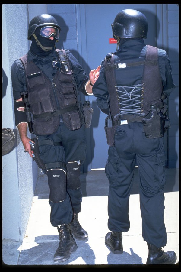 428020 Two Swat Team Members Confer A4 Photo Print