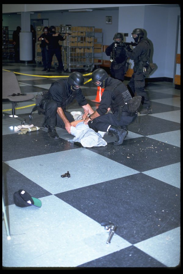 428082 Role Play Exercise, Dead Suspect Is Cuffed A4 Photo Print