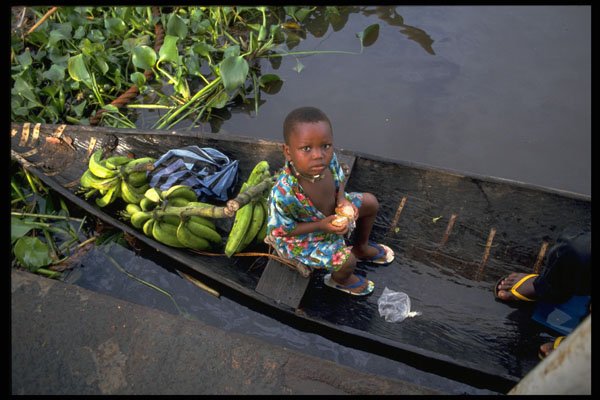 429009 Boy In Canoe, Nigeria A4 Photo Print