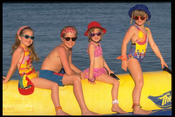 429049 Children On Banana Float A4 Photo Print