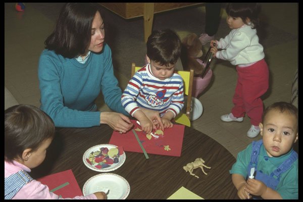 429080 Mother And Three Children Pasting At Table A4 Photo Print