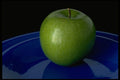 437084 Green Apple On Blue Plate A4 Photo Print