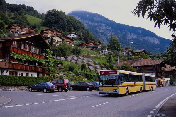 439050 Car Passes Rugged Terrain On The Grimsel Pass Road A4 Photo Print