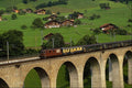 439071 Passenger Train Crosses High Bridge In Frutigen A4 Photo Print