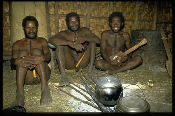 446067 Dani Men With Wooden Guitar Inside Honai, Tangma A4 Photo Print