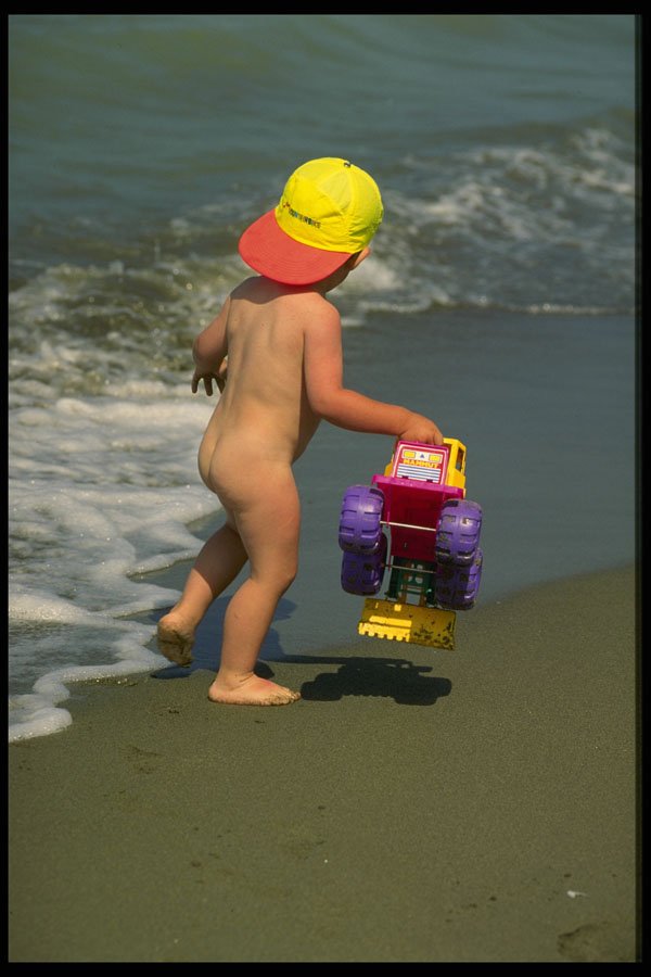 448091 Young Boy At The Beach With Tractor A4 Photo Print