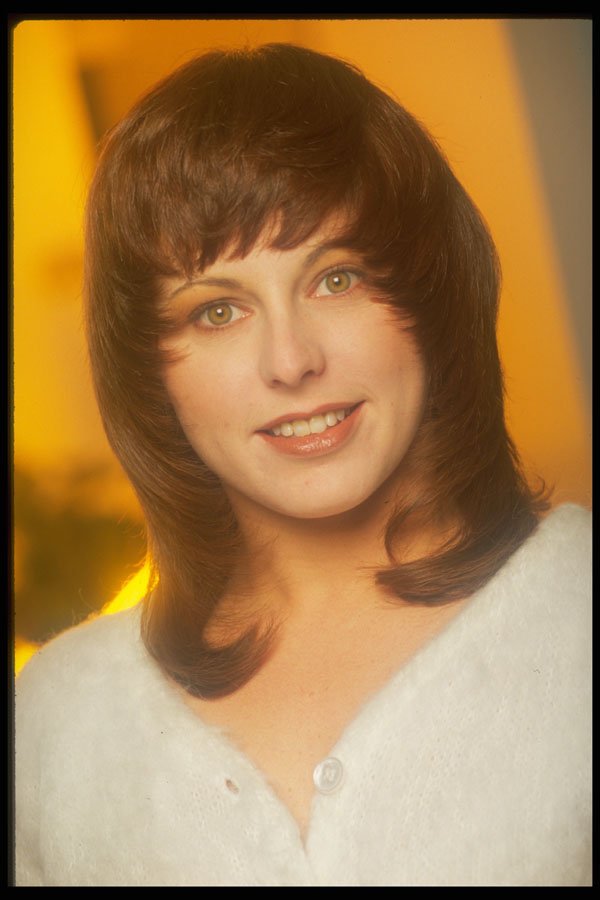 451002 Forward swept Shag, Model Wearing White Sweater A4 Photo Print