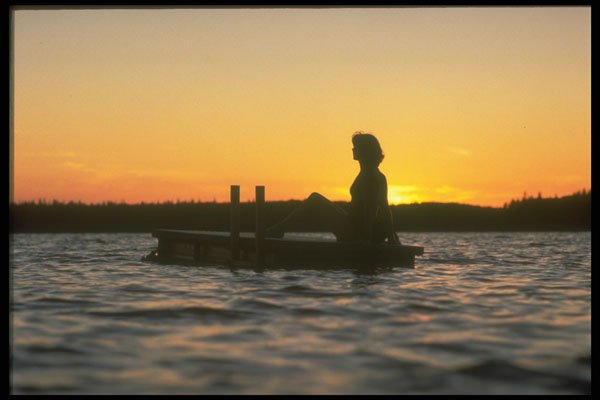 460012 Swimmer On Raft At Sunset On Canadian Lake A4 Photo Print