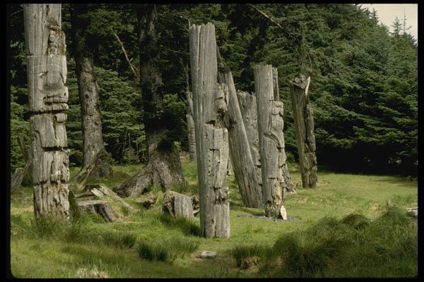 466014 Tilted Haida Totems, Queen Charlotte Island, Canada A4 Photo Print