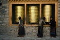 467096 Three Prayer Wheels And Pilgrims, Sakya Monastery, Tibet A4 Photo Print