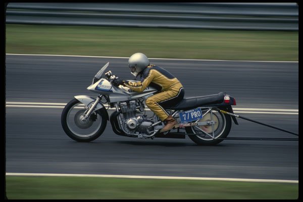 474052 A Suzuki Drag Bike Flies Down The Quarter mile Strip A4 Photo Print