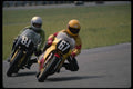 474054 Two Riders Slipstream Into A Tight Left hander A4 Photo Print