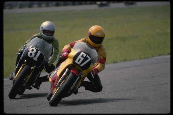474054 Two Riders Slipstream Into A Tight Left hander A4 Photo Print