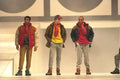 475036 Three Males In Casual Boots, Jeans And Padded Jackets A4 Photo Print
