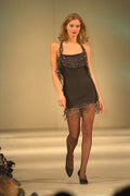 475066 Female In Black Minidress With Long Bead Decoration A4 Photo Print