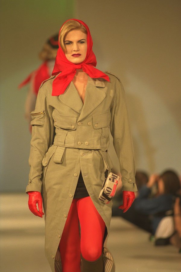 475098 Female In Long, Light Brown Raincoat And Red Headscarf A4 Photo Print