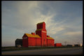 477015 Scarlet Pioneer Grain Elevators, Saskatchewan A4 Photo Print