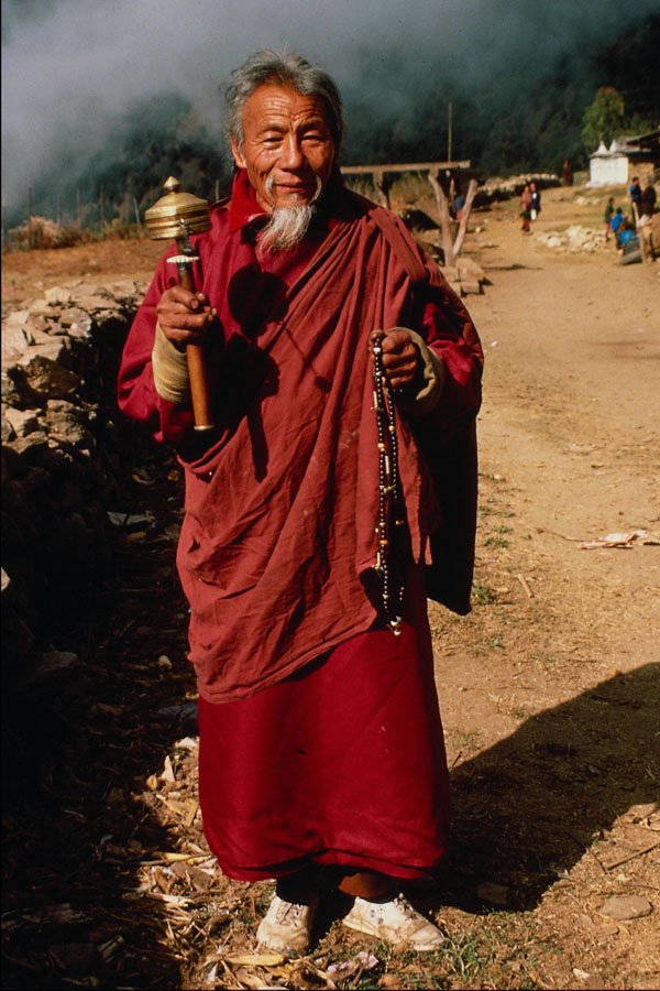 481081 Itinerant Buddhist Monk With Prayer Wheel, India A4 Photo Print