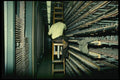 489037 Worker In Racks Pulling Wire A4 Photo Print