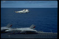 496010 SH 3 Hovers Over An F 14 On Deck A4 Photo Print