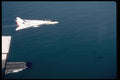 496054 F 14 Tomcat Flies Low Over The Bow Of The Carrier A4 Photo Print
