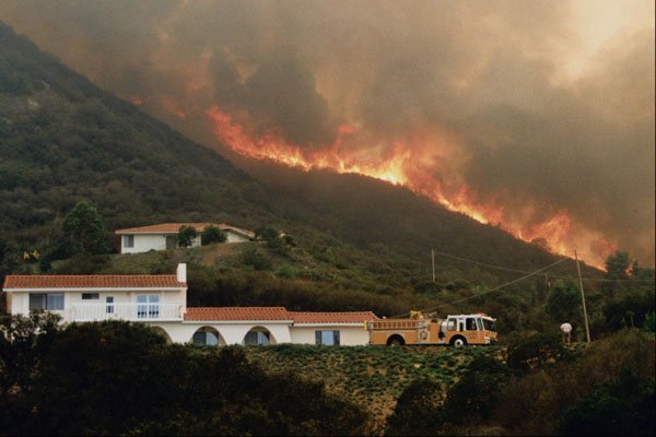 505075 Home Above Wild Animal Park Threatened By Flames A4 Photo Print