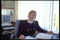 506000 Woman At Office Desk A4 Photo Print