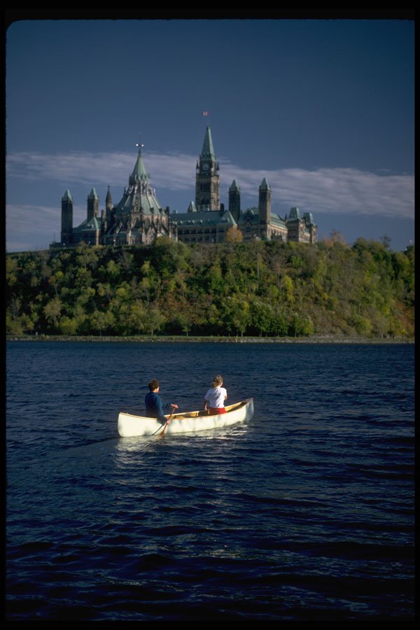511079 Canoeists Beneath The Parliament Buildings, Ottawa, Canada A4 Photo Print