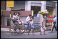 512053 Rickshaw Driver On A Street In Calcutta, India A4 Photo Print