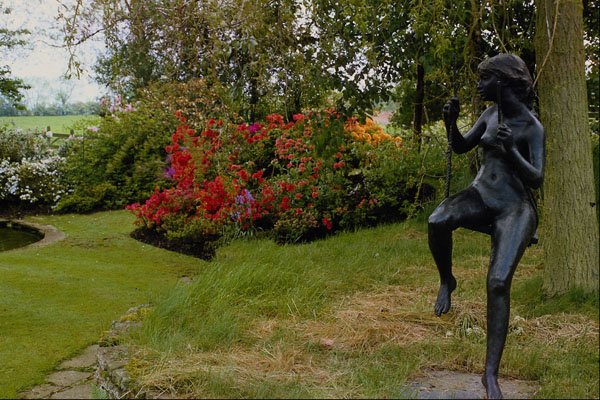 516082 Bronze Statue In English Country Garden, England A4 Photo Print