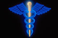 520016 Blue And White Caduceus Over Black Background A4 Photo Print