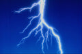 520035 Lightning Bolt Over Blue Background A4 Photo Print