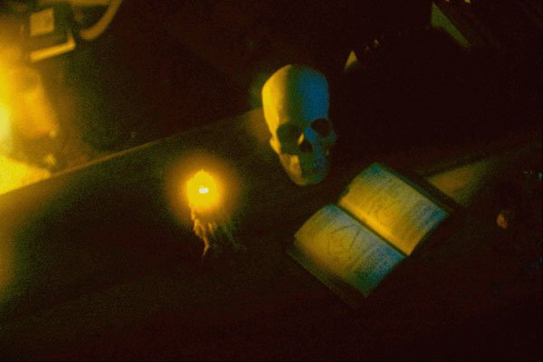 520066 Skull, Book And Candle On Table A4 Photo Print