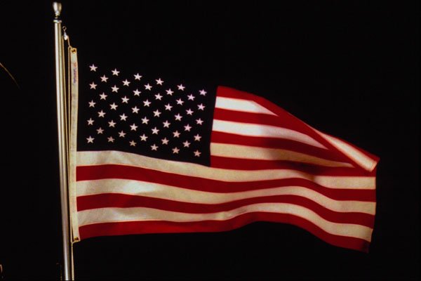 520097 Waving U.S. Flag On Pole A4 Photo Print
