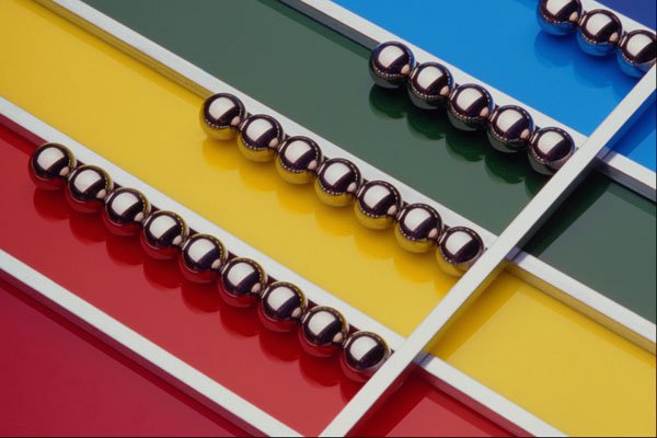 529096 Steel Balls And Rods On Multicolored Acrylic A4 Photo Print