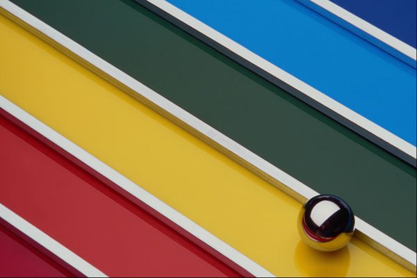 529097 Steel Ball And Rods On Multicolored Acrylic A4 Photo Print