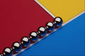 530098 Steel Balls And Rods On Multicolored Acrylic A4 Photo Print