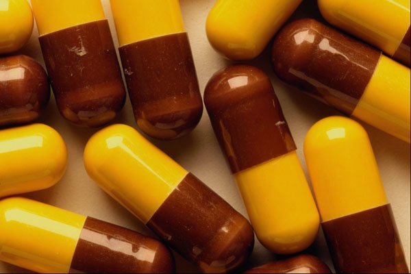 532088 Brown And Yellow Study Pills A4 Photo Print