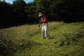 534080 Farmer Scything Grass, Romania A4 Photo Print