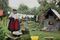 534092 Traditional Farmyard, Washing Clothes, Hoteni, Romania A4 Photo Print