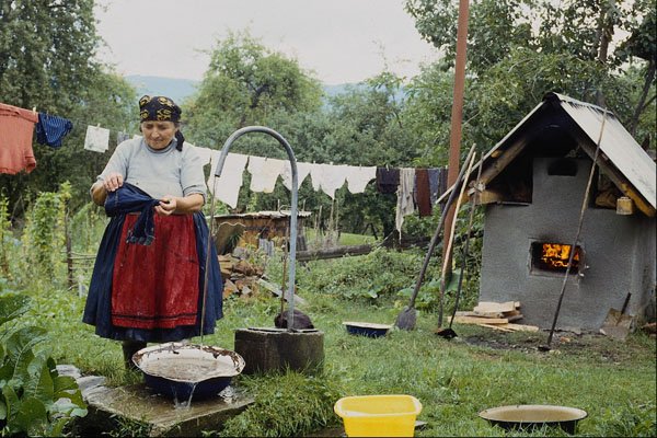 534092 Traditional Farmyard, Washing Clothes, Hoteni, Romania A4 Photo Print