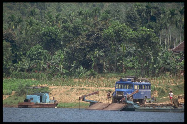 538058 A Bus On A Barge Crossing The Perfumes River, Hue, Vietnam A4 Photo Print