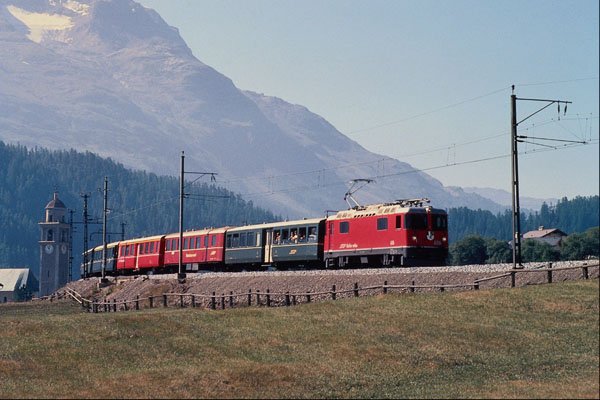 543026 St. Moritz Chur Train Leaving Celerina, Switzerland A4 Photo Print